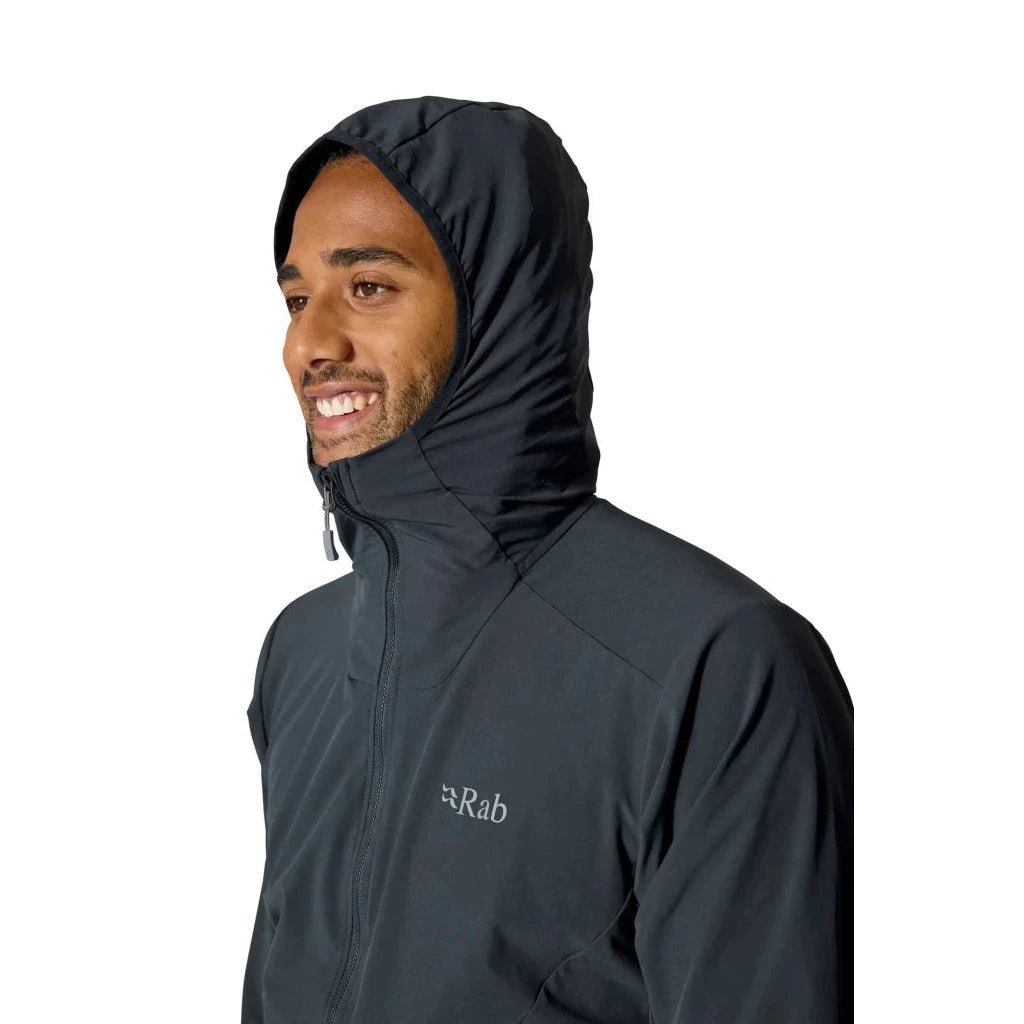 Side profile of man in Rab Borealis dark grey softshell hoody with hood
